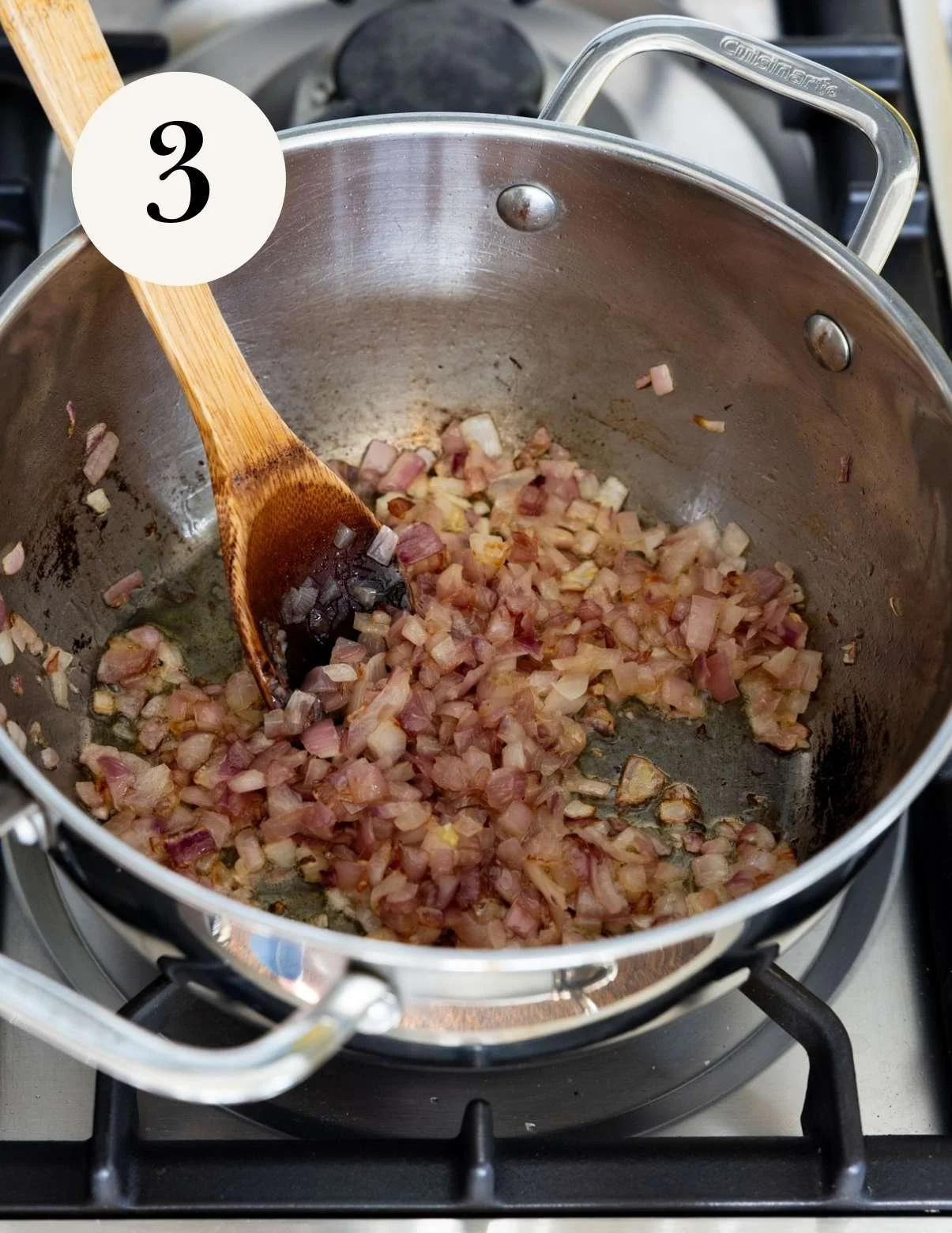 red onions sauteing in a pan