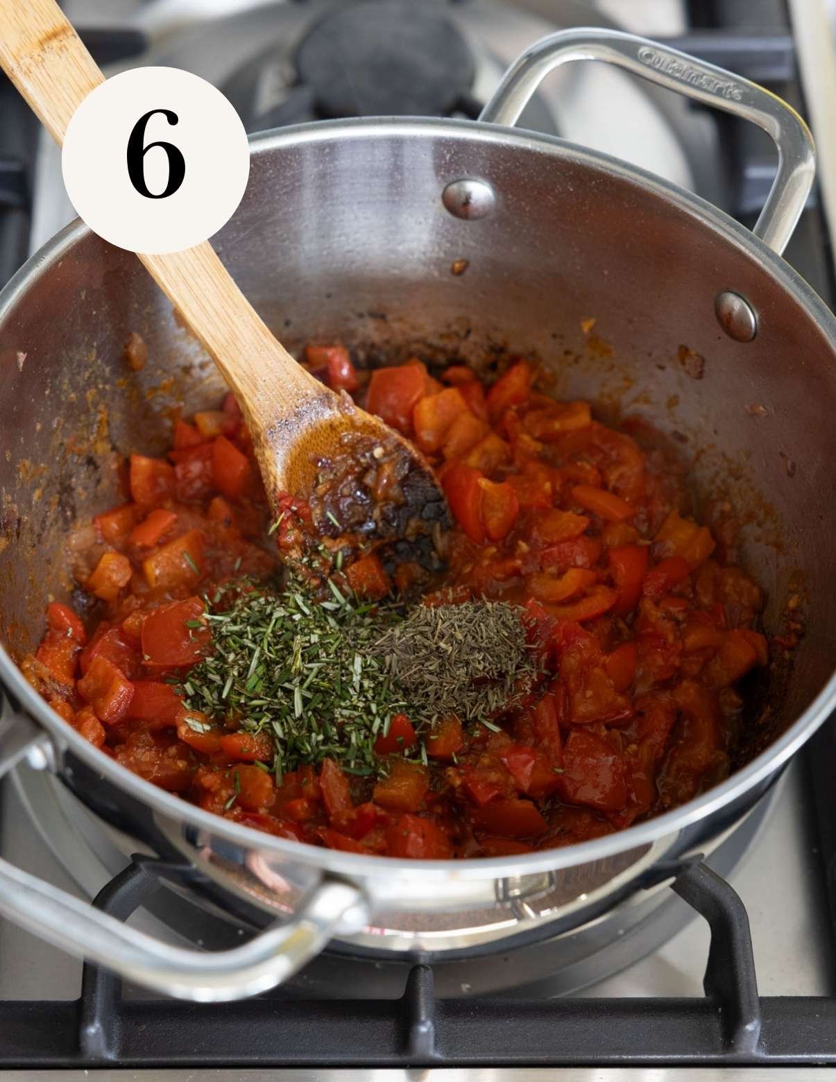 adding tomatoes to the pan