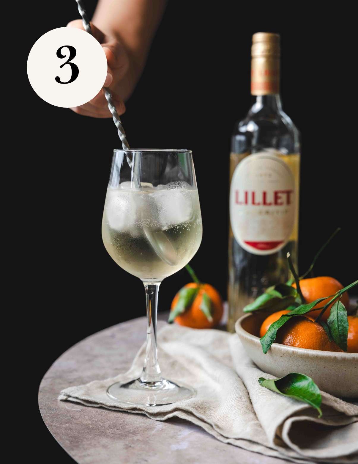 gently stirring a lillet blanc spritz