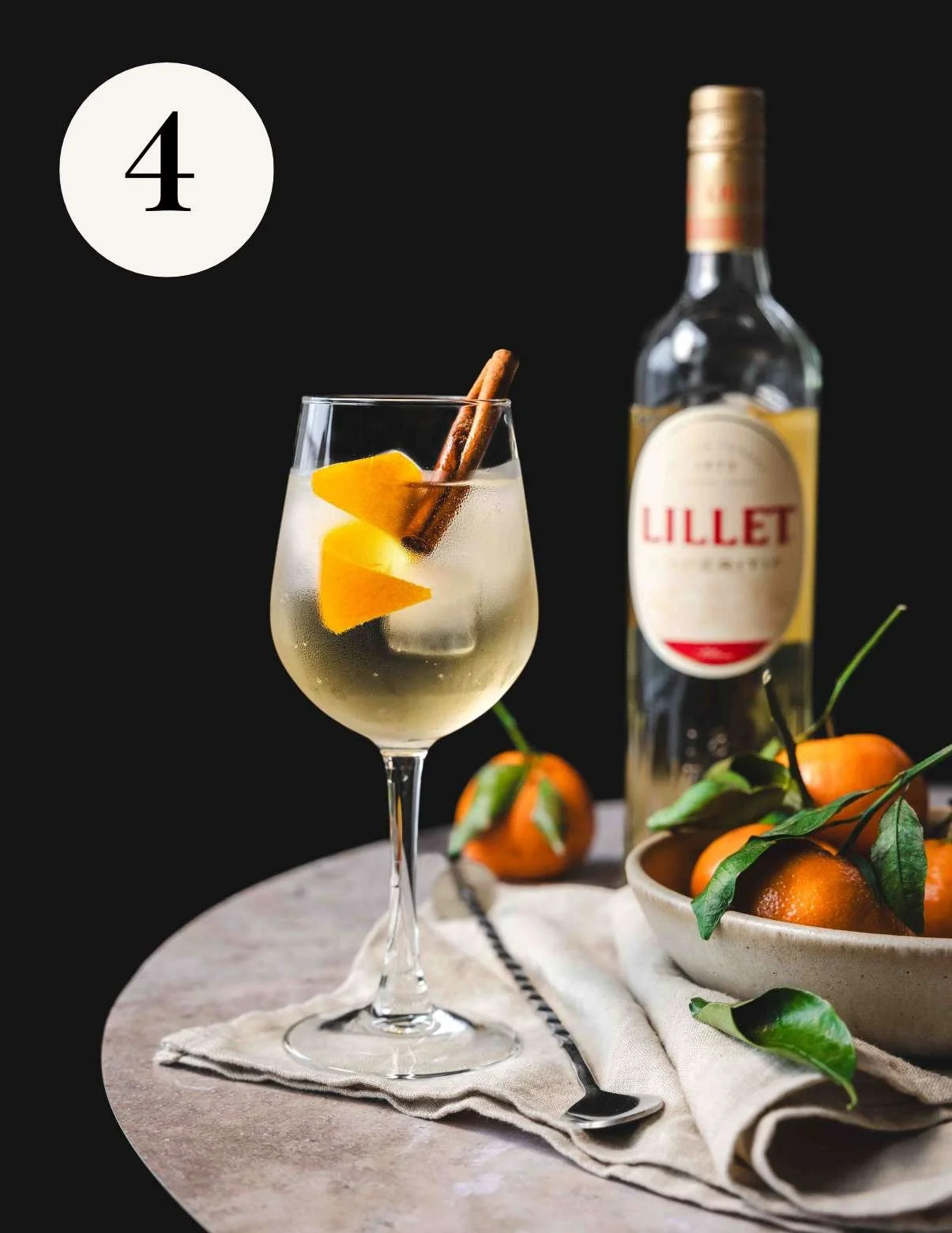 lillet blanc sprirz garnished with an orange twist