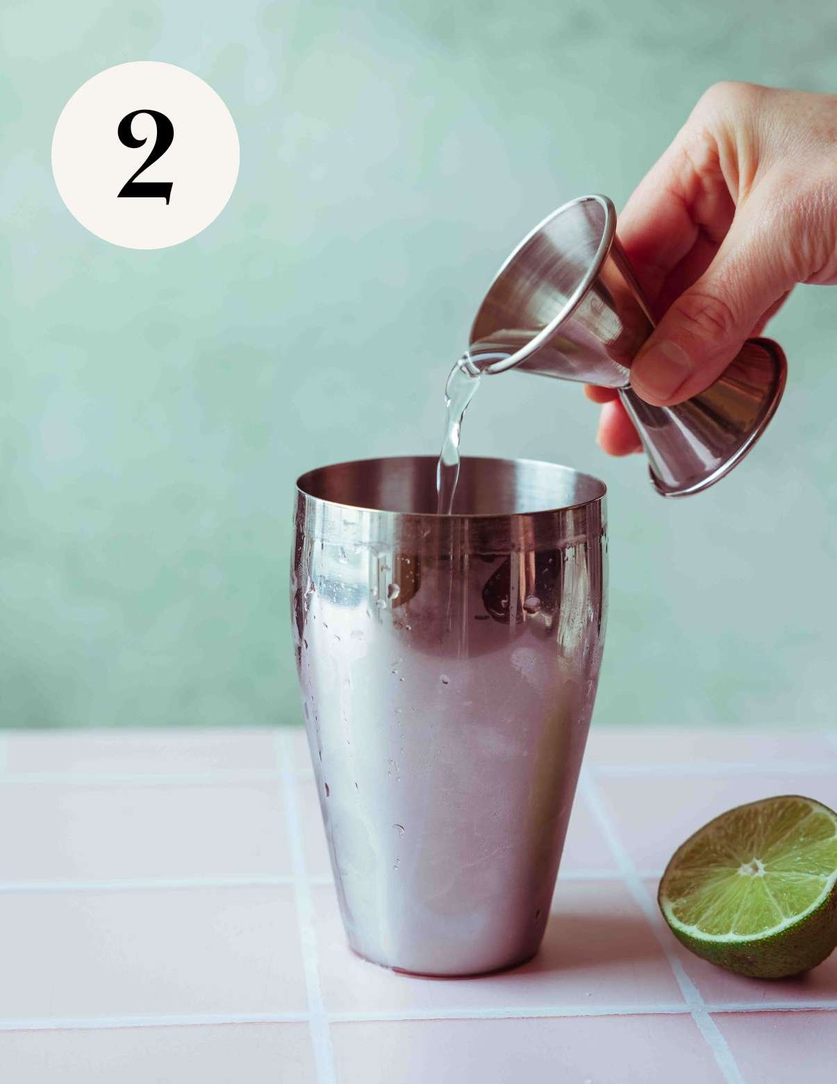 pouring in vodka and the other ingredients