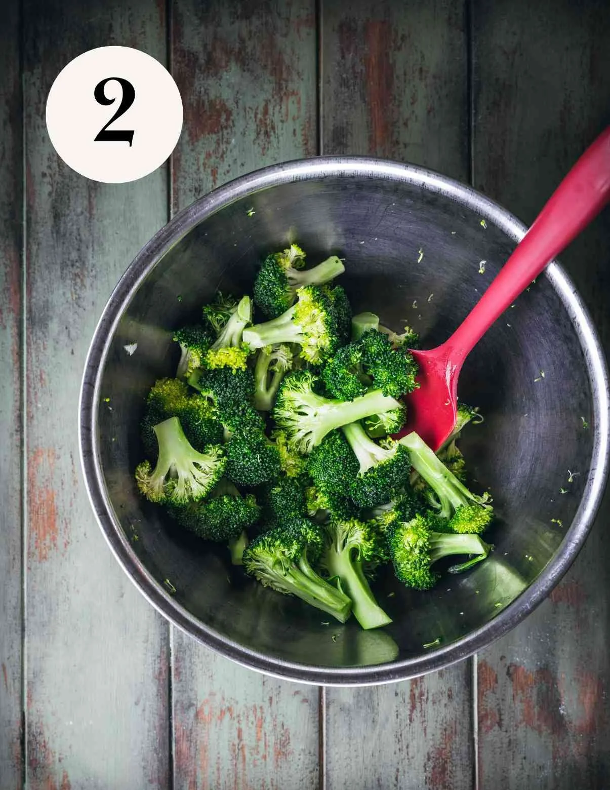 broccoli in a bowl tossed with olive oil