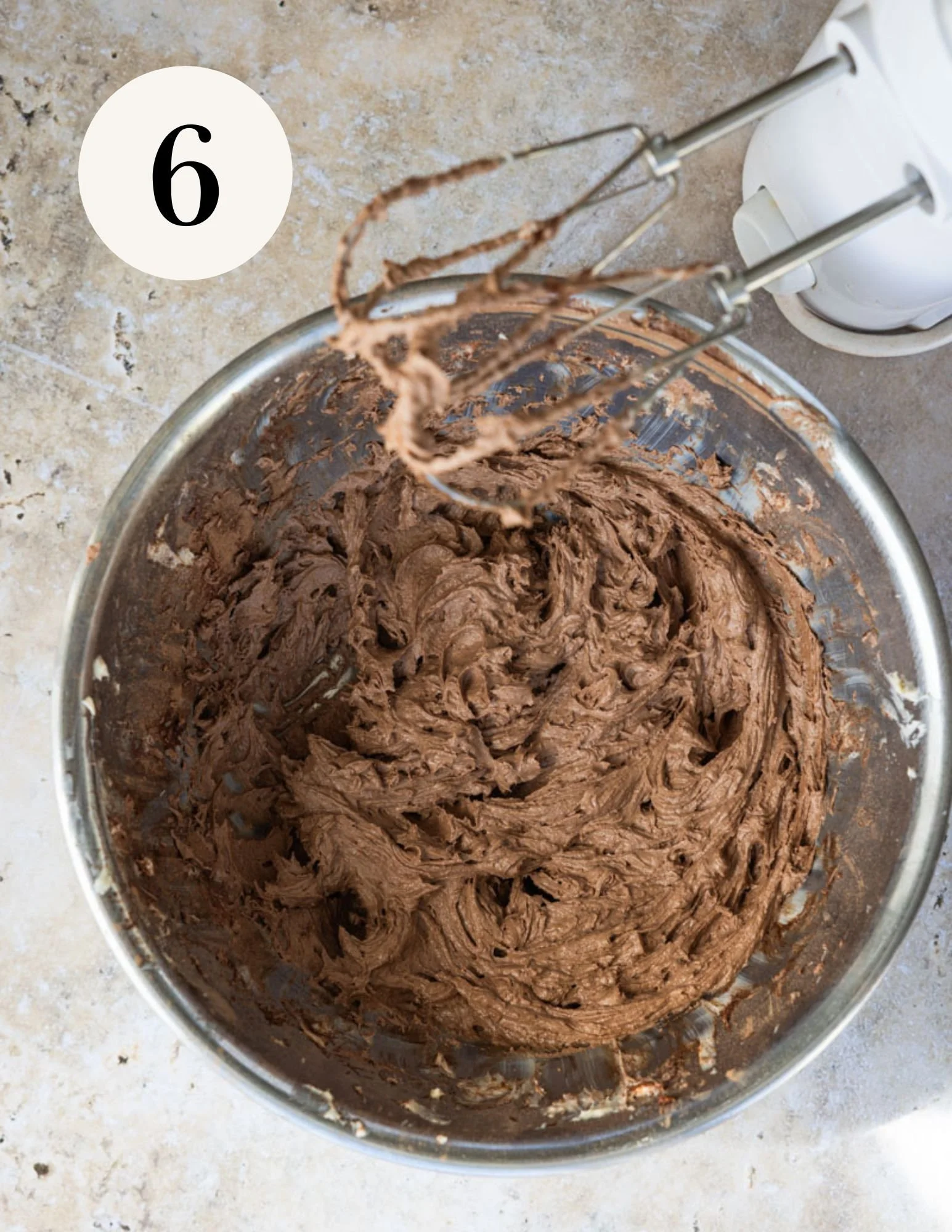add the cocoa powder and vanilla and whip until fluffy