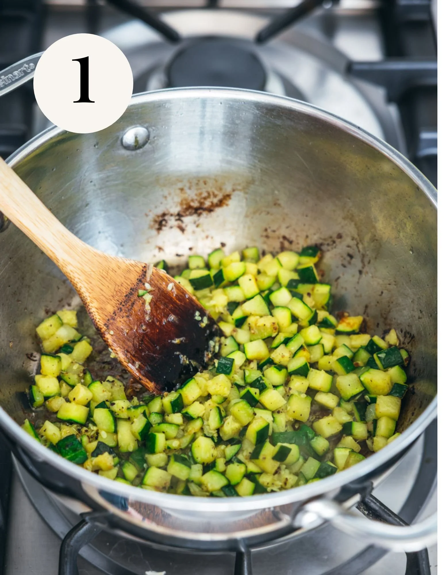 zucchini in a large deep sauté pan on the stovetop