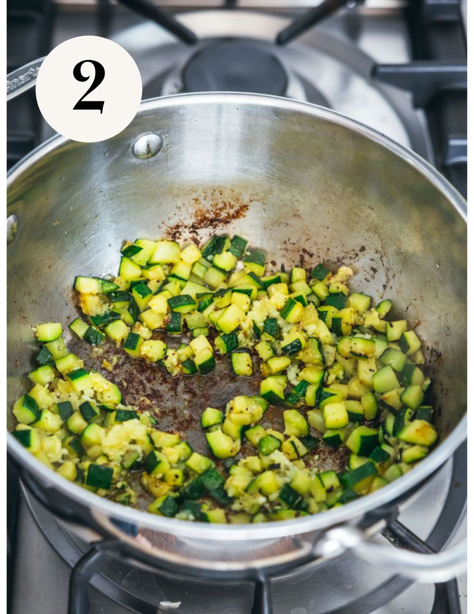 zucchini in a large deep sauté pan on the stovetop