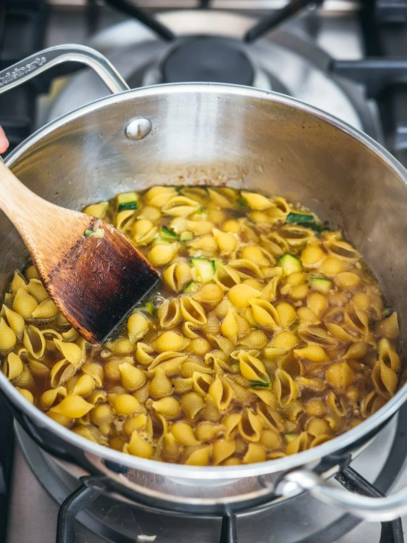 . Once boiling, stir in the pasta, making sure it’s just submerged in the liquid.