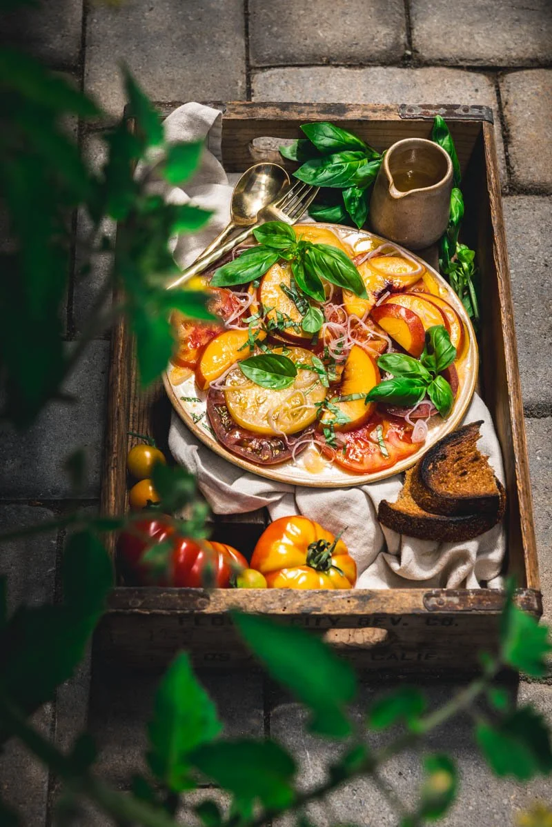 tomato crudo with stone fruit and orange vinaigrette