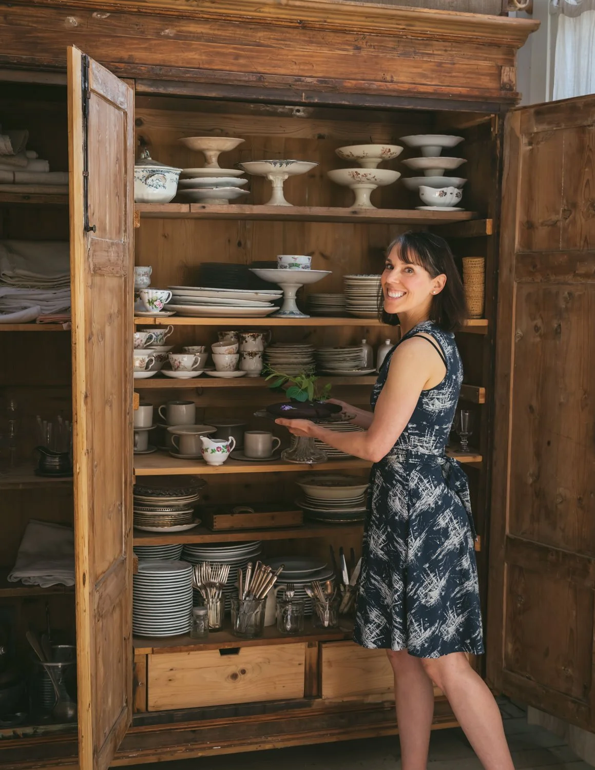 Carol in front of a cupboard in Florence