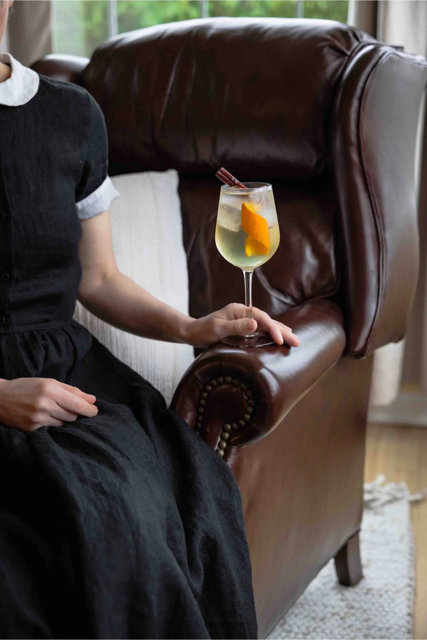 Carol holding a lillet blanc spritz