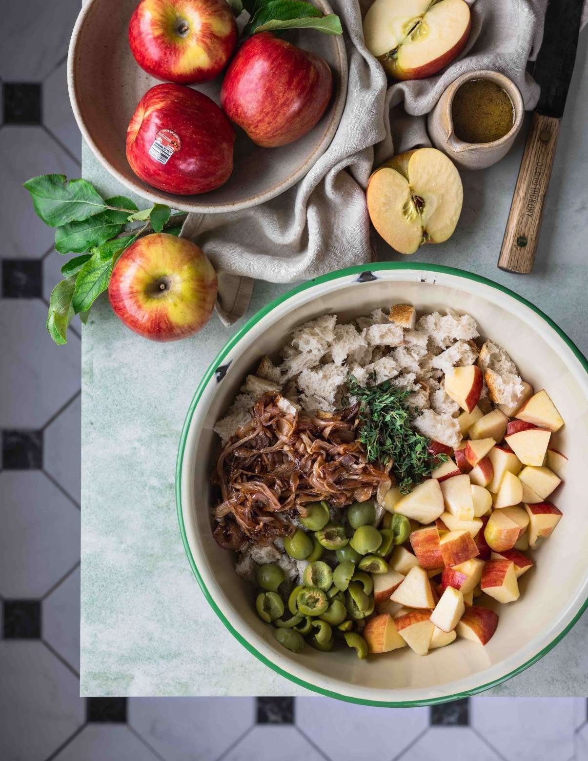 ingredients for apple panzanella salad in a bowl