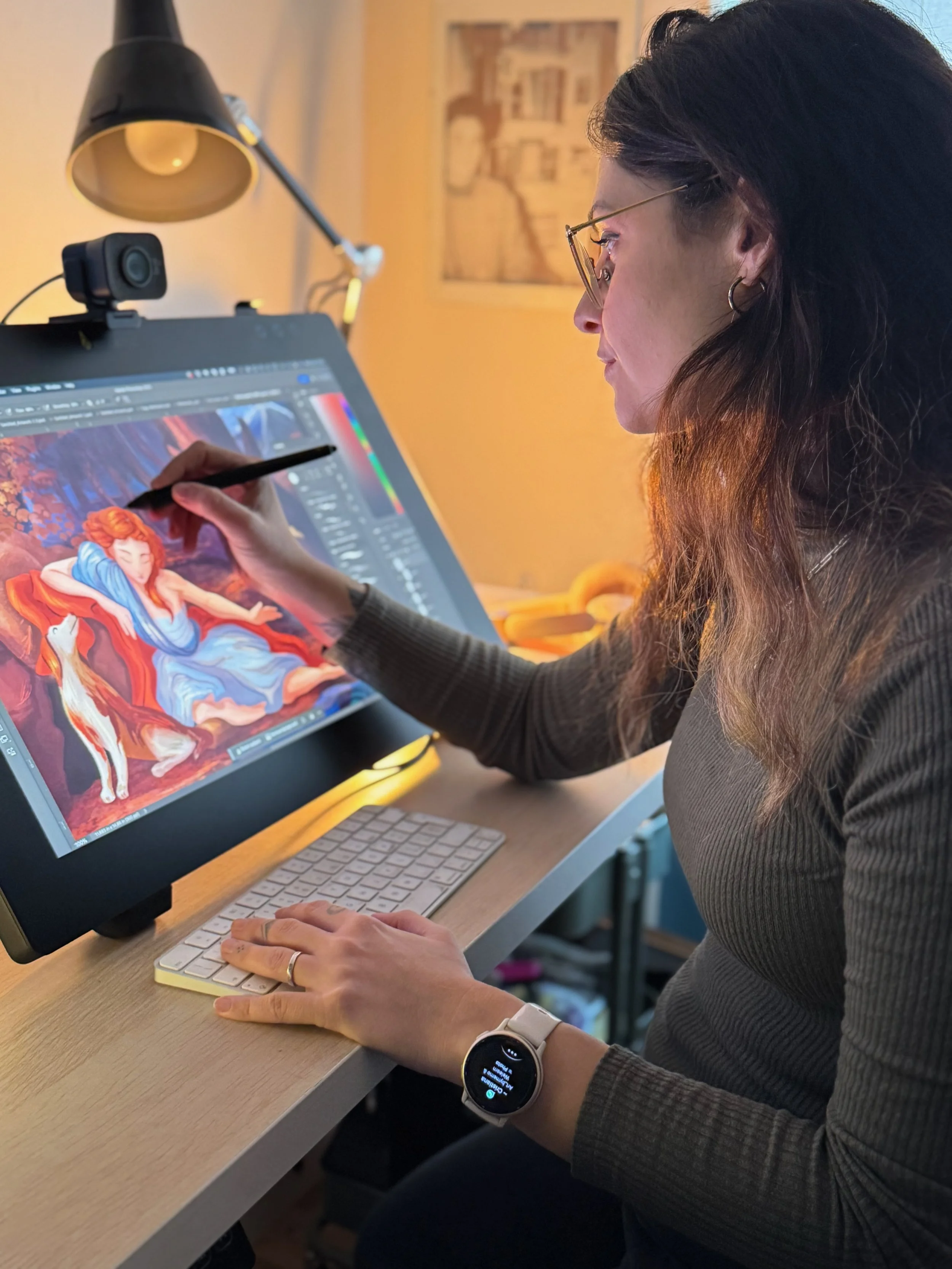 Freelance illustrator working at a desk in a home studio,