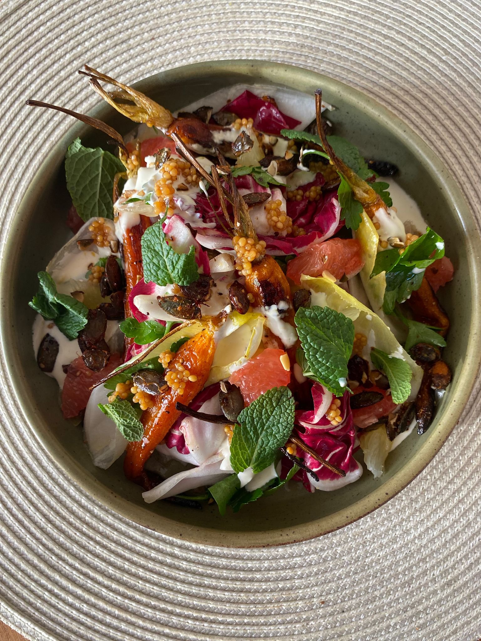 Honey roasted carrots with bitter leaves, creme fraiche, pickled mustard seeds and citrus
