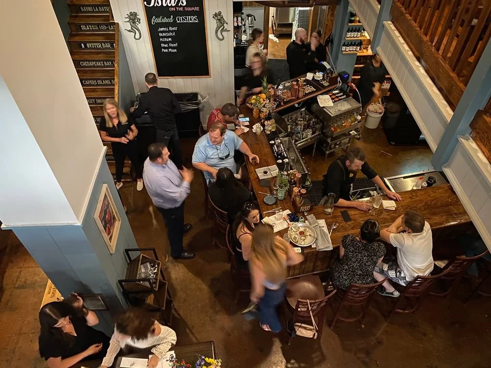 View of cocktail bar from second floor window seating