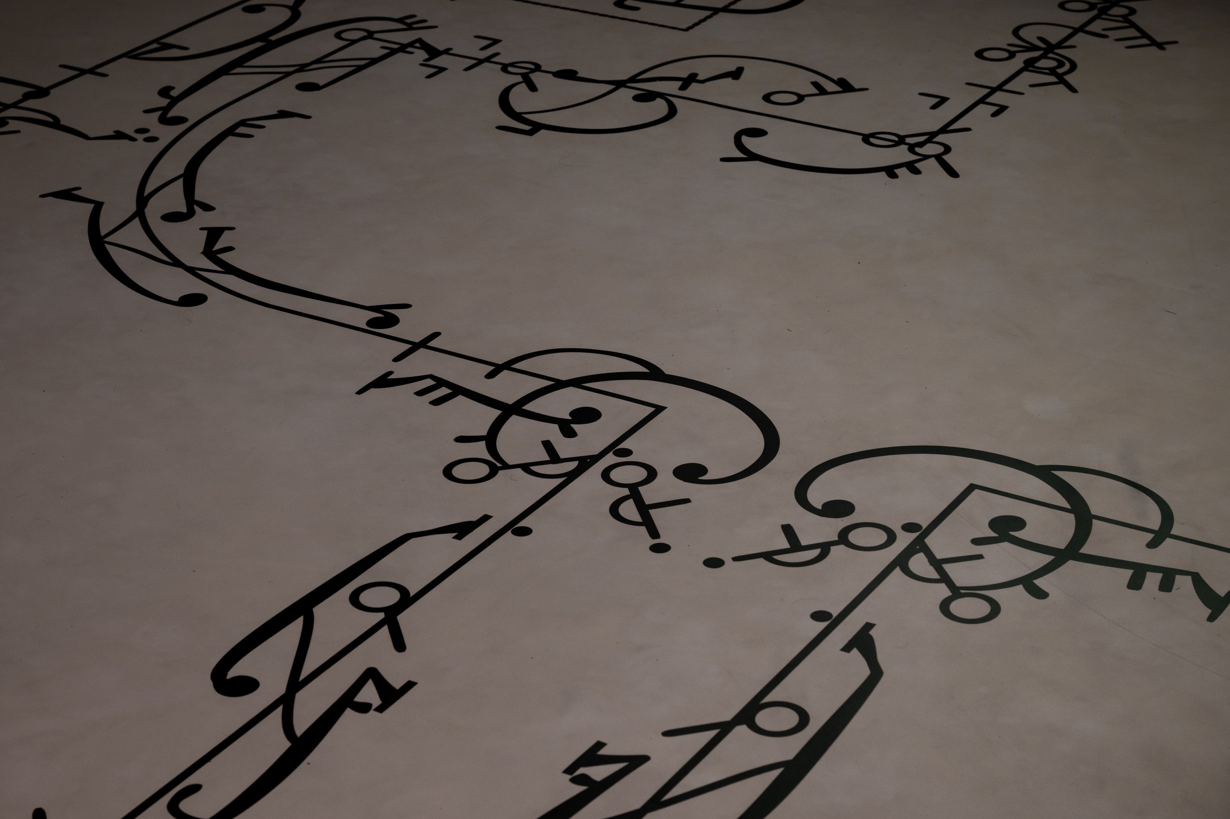 Close up of vinyl mat printed with Beauchamp-Feuillet Notation (1701) for Pretending Make Believe / If You Look Close Enough You Can See My Thoughts dance film, exhibition at Kings ARI. Photo: Sebastian Kainey.