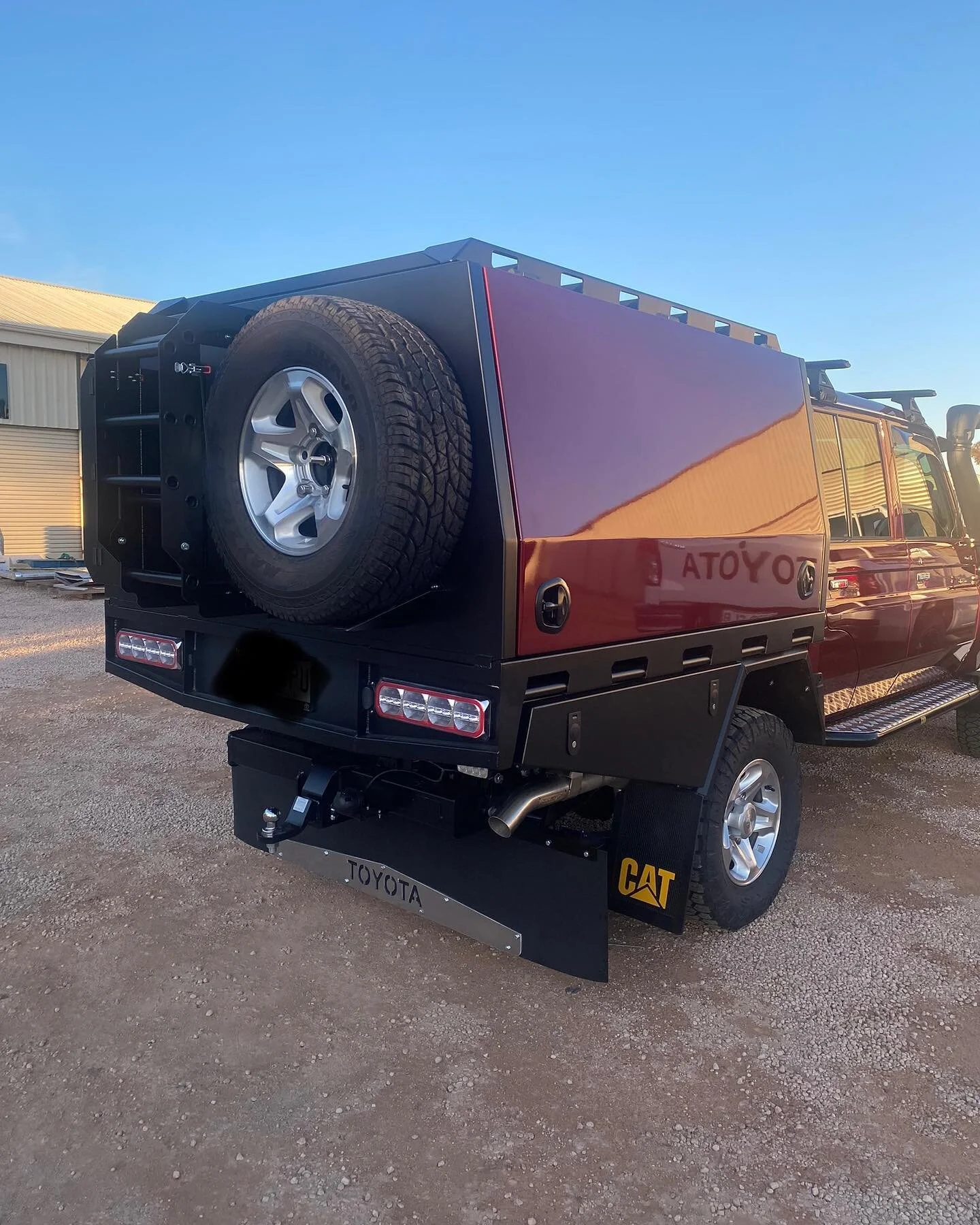 79series dual cab, chassis mounted canopy. 

Canopy specs include; custom roof rack, spare wheel mount, double mini jerry can holder &amp; ladder. Toyota mud flap sign also designed and cut in house on the CNC plasma. 

Canopy body &amp; accessories 