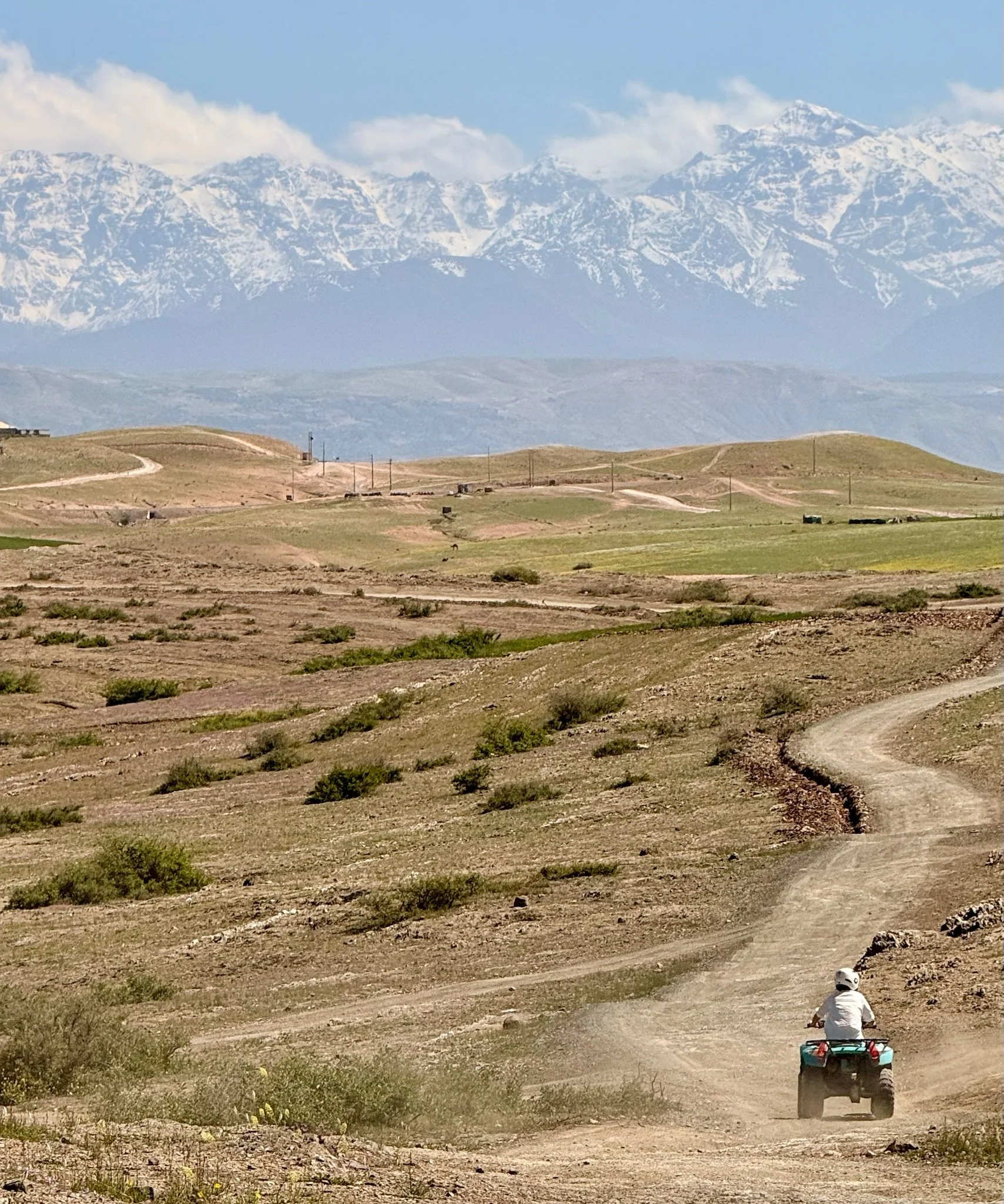 Trying to get the shot without getting left behind .. Atlas Mountains in the background