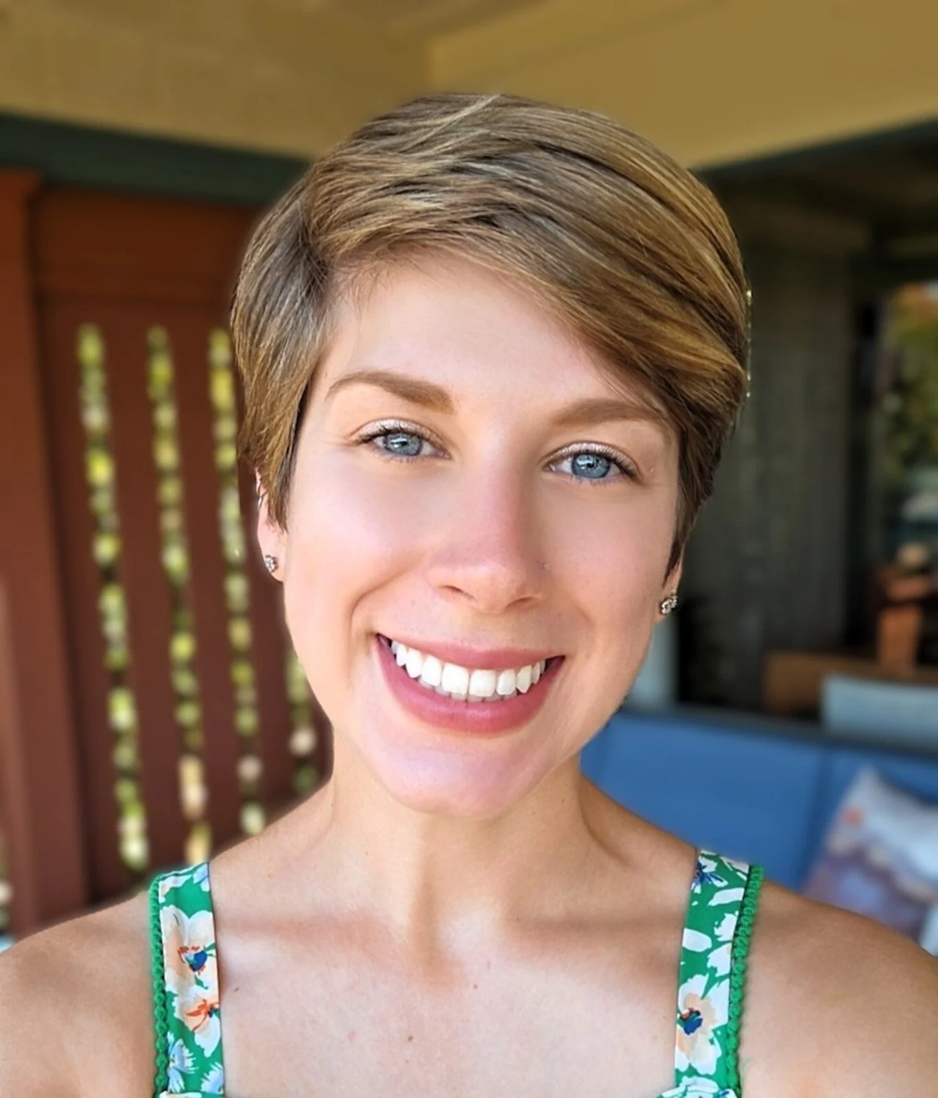 Lara Baggio, associate marriage and family therapist, smiling in a green floral top