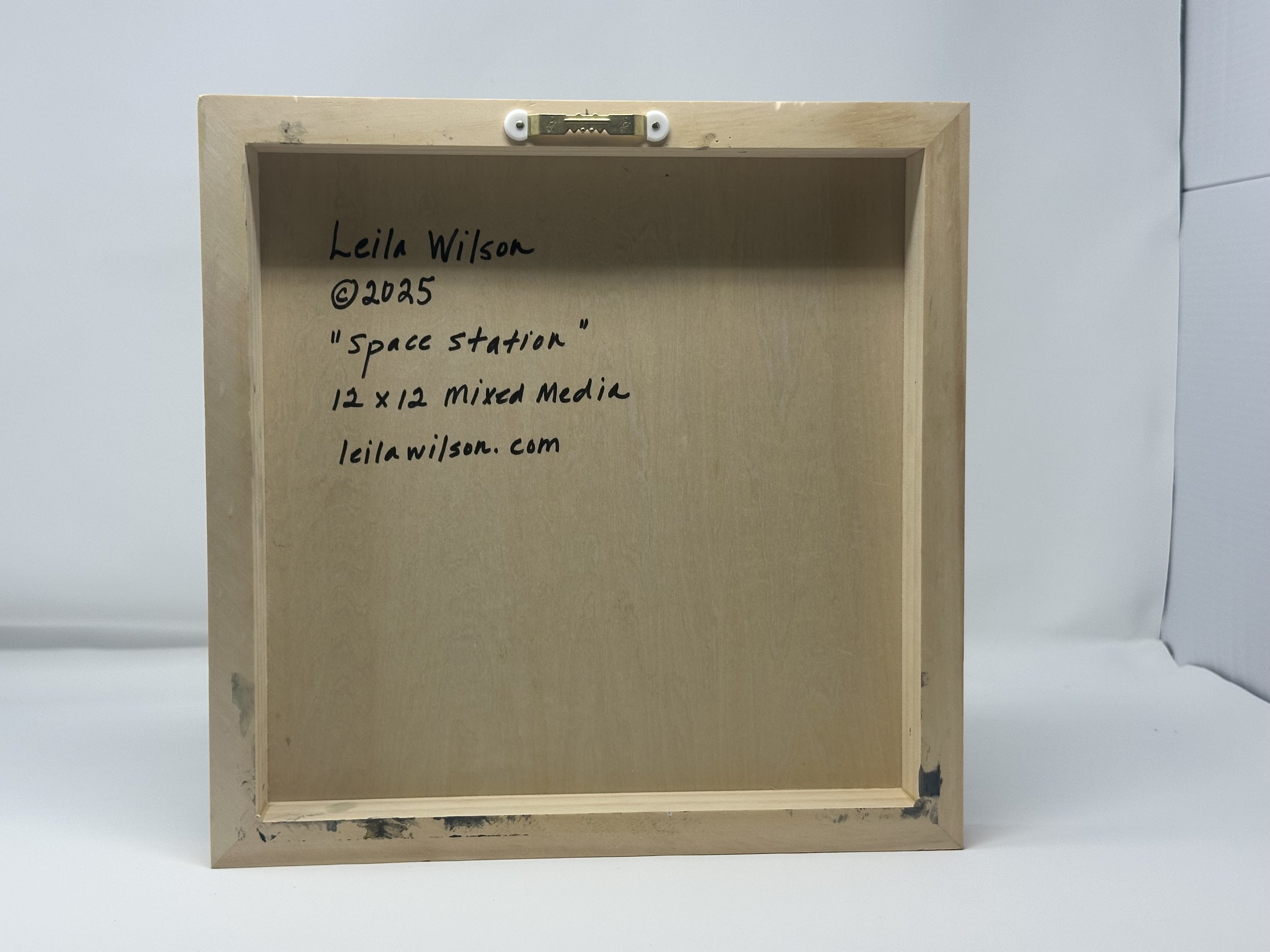 Leila-Wilson_2025_SpaceStation_12x12x1.5_Cradleboard_4Back.jpeg