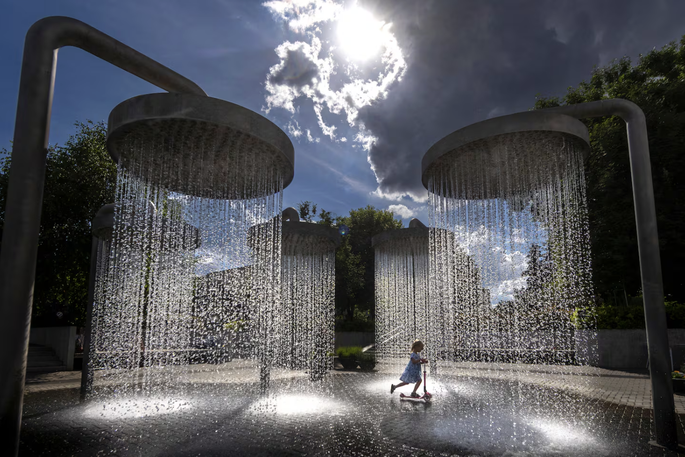 A girl cooled off in a public fountain in Vilnius, Lithuania, on June 26.Mindaugas Kulbis/AP Photo