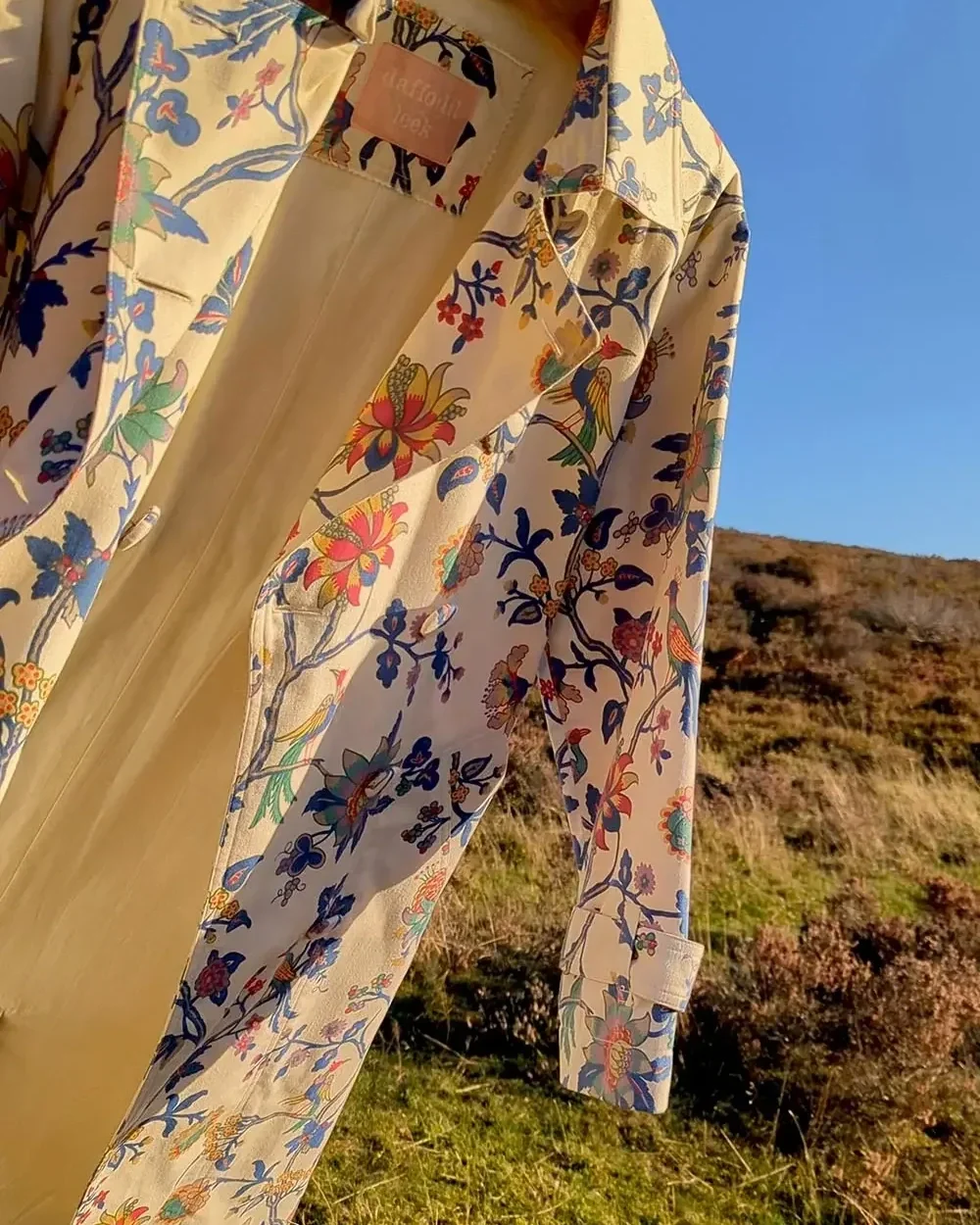 statement-floral-trench-coat-daffodil-and-leek.webp