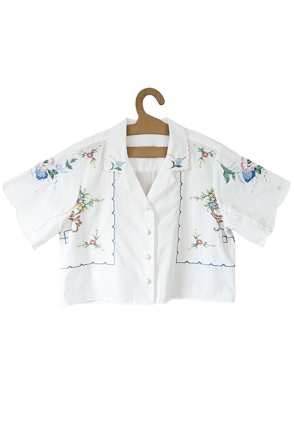 White cotton blouse with floral embroidery and button front