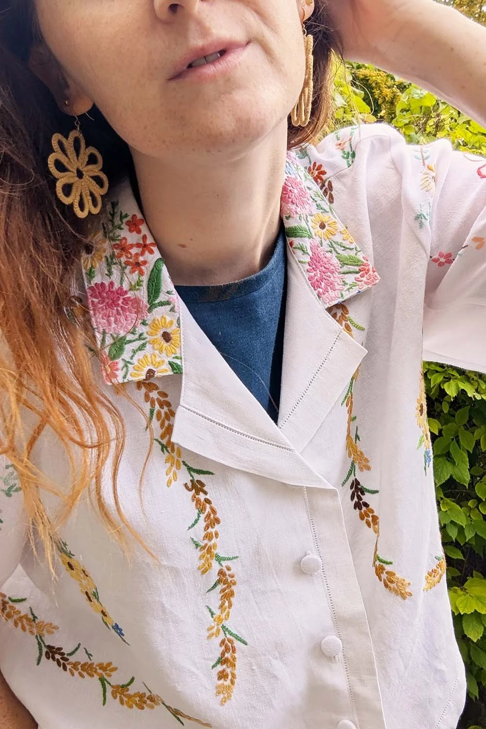 classic white blouse with colouful embroidery