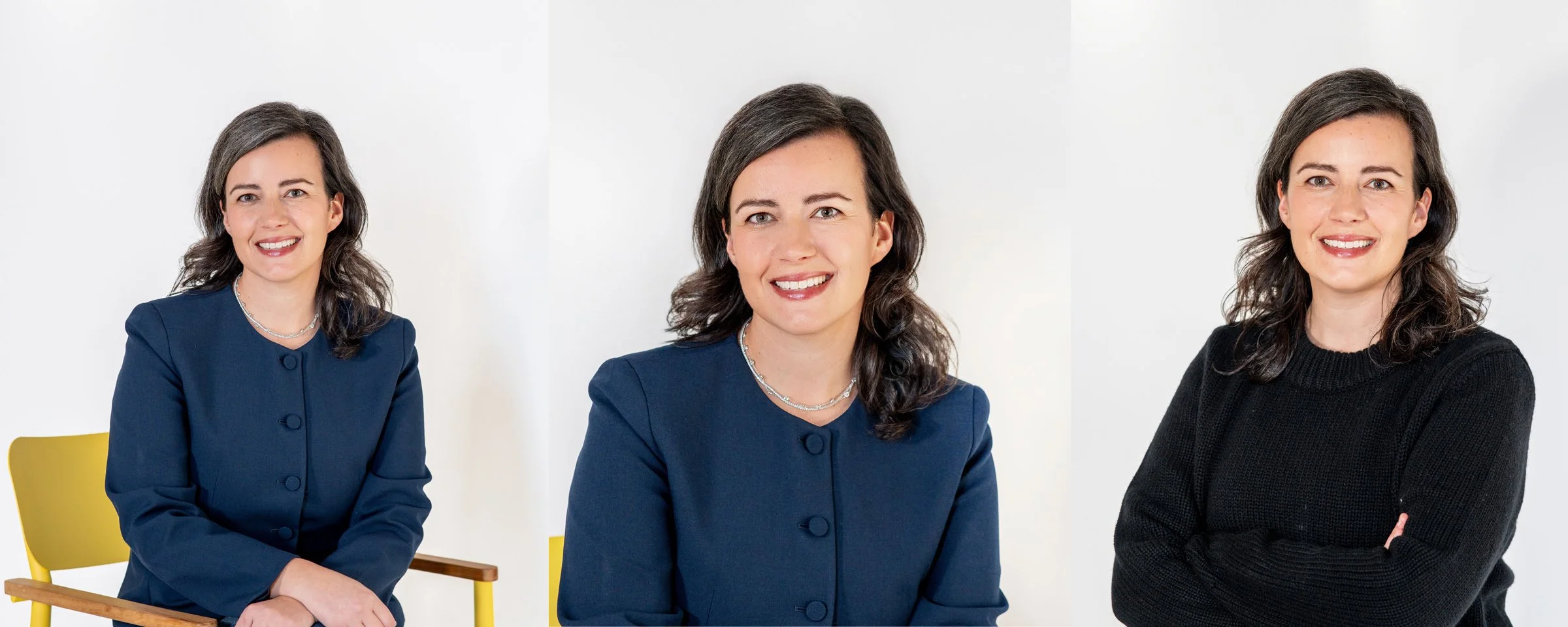 A woman with dark brown hair and fair skin, wearing a navy blazer and a silver necklace, smiling at the camera, sitting in a yellow chair. The image shows her in three different poses against a white background.
