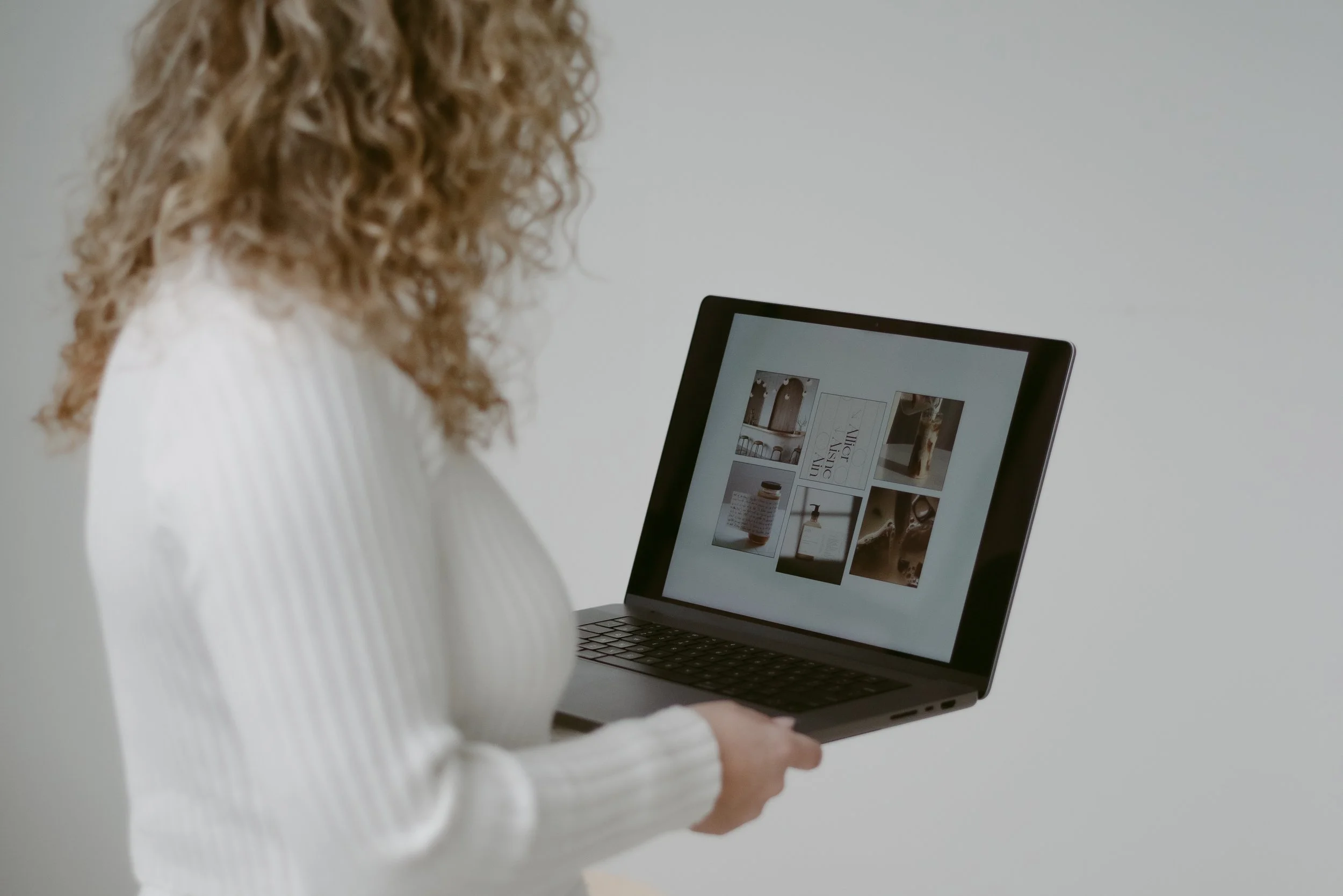 Kiki Maldonado working on a laptop
