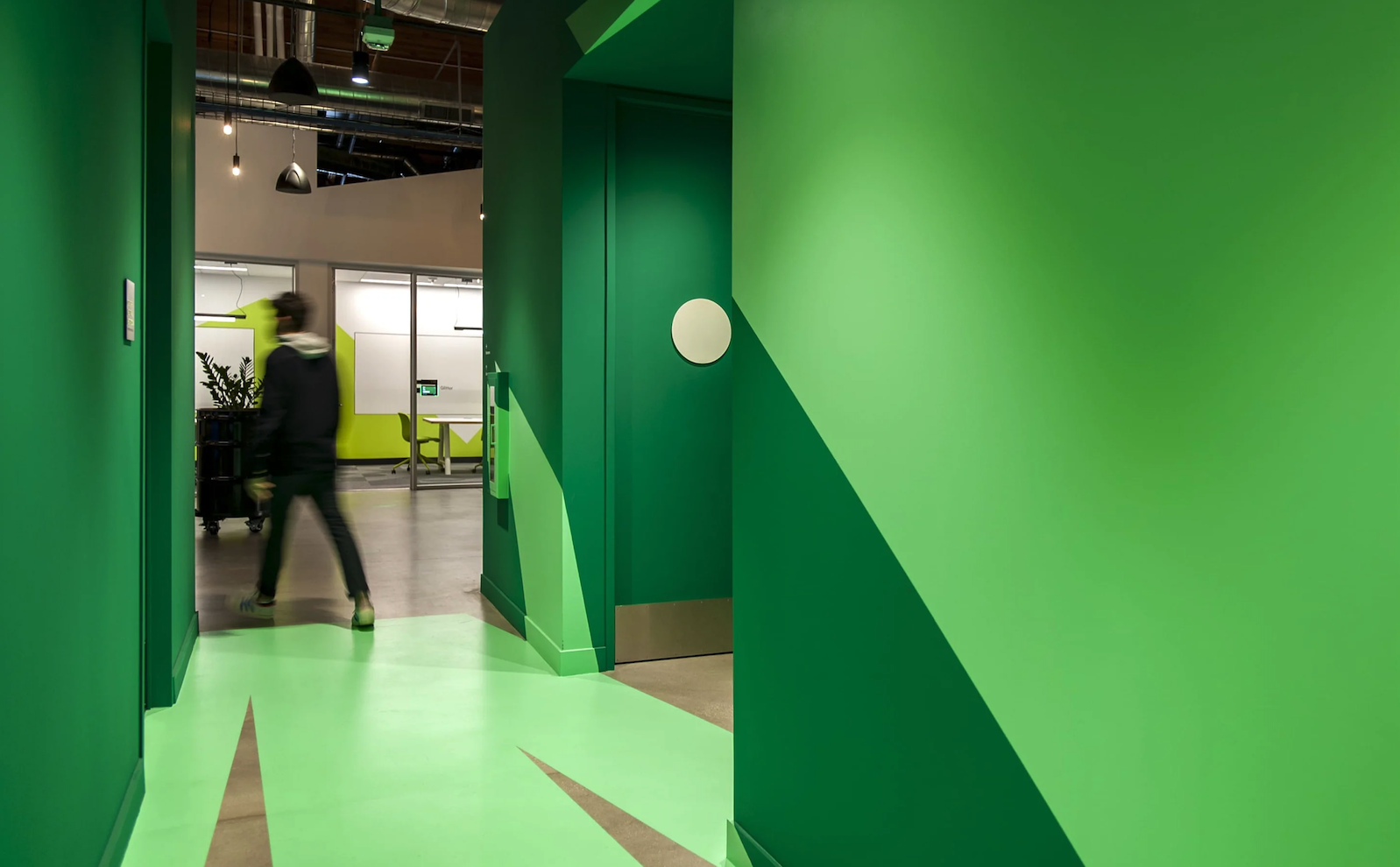 Anamorphic graphic installations add moments of surprise for users and activate otherwise back-of-house spaces