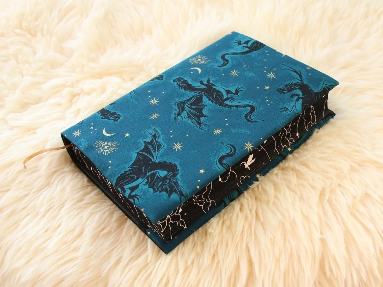Handmade fabric first edition book jacket made from fantasy-inspired print showing hardcover special edition book protection.