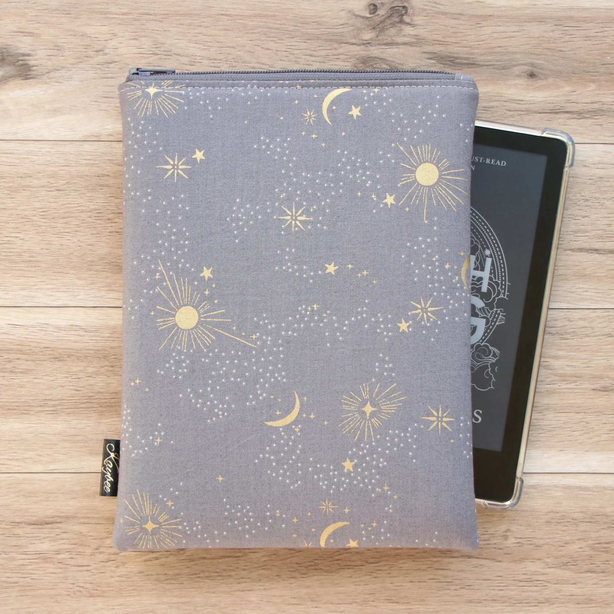 The First Edition Kindle Sleeve handmade in New Zealand featuring premium cosmos-inspired fabric, foam padding and a YKK zipper.