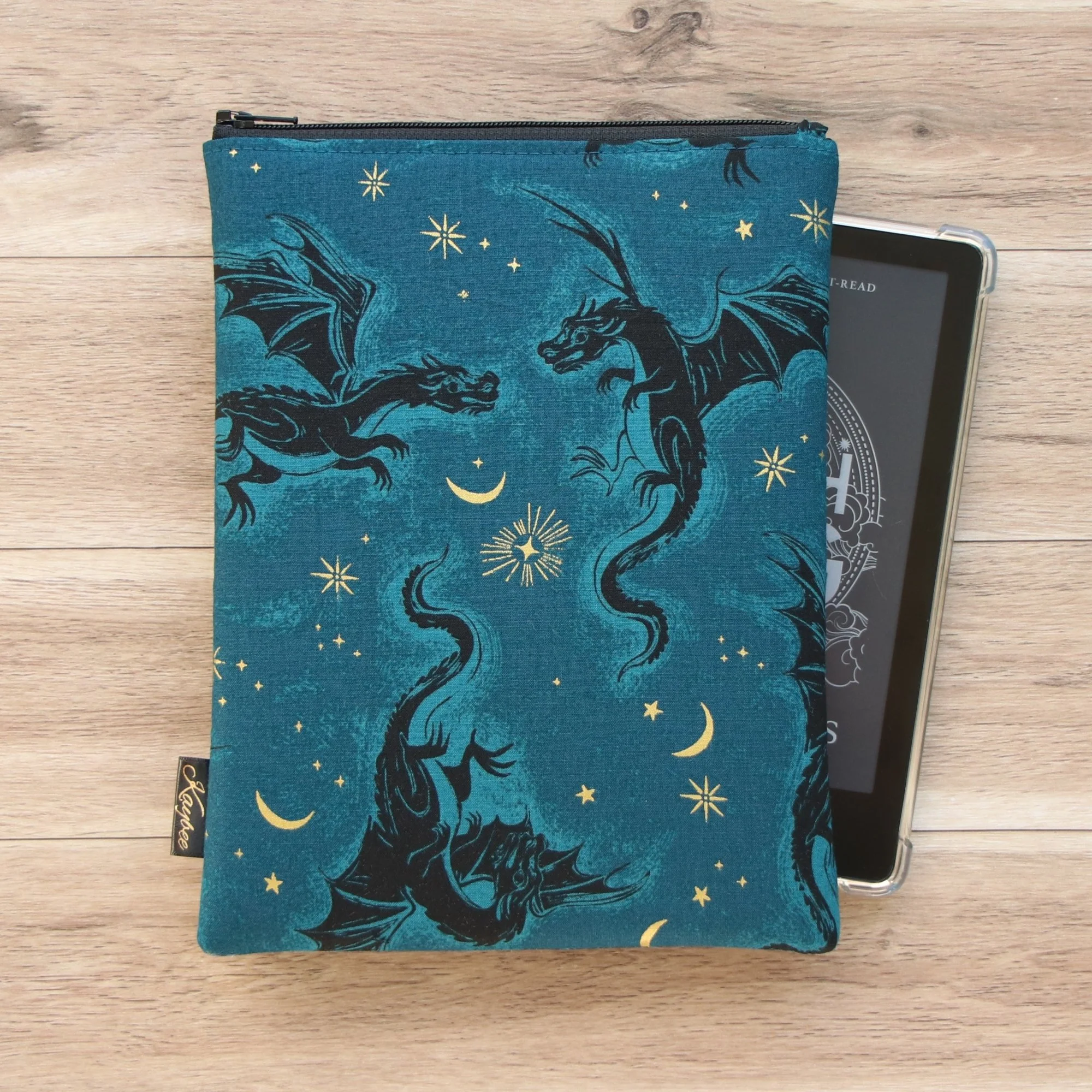 The First Edition Kindle Sleeve handmade in New Zealand featuring premium dragon-scale fabric, foam padding and a YKK zipper.