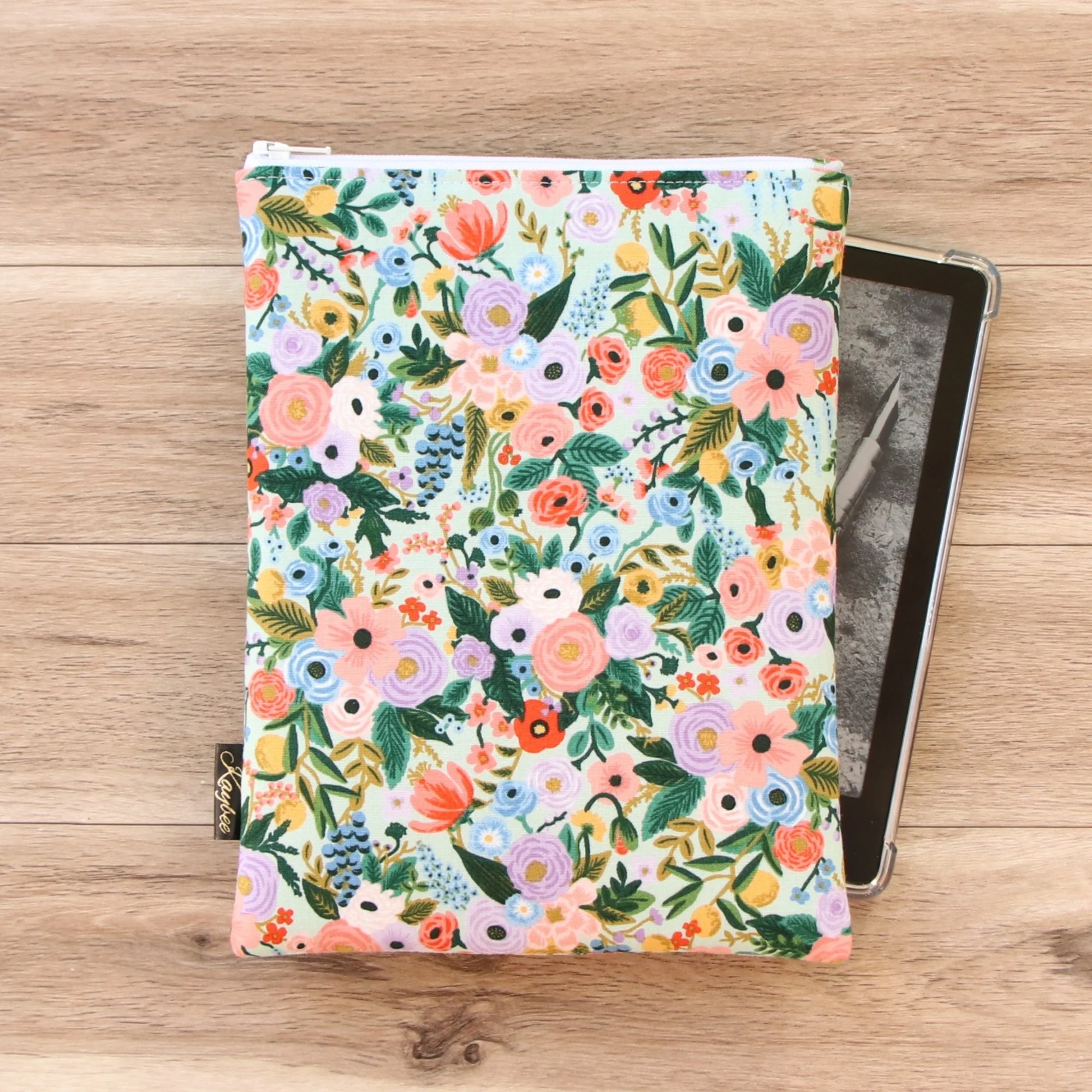 The First Edition Kindle Sleeve handmade in New Zealand featuring premium Rifle Paper Co fabric, foam padding and a YKK zipper.