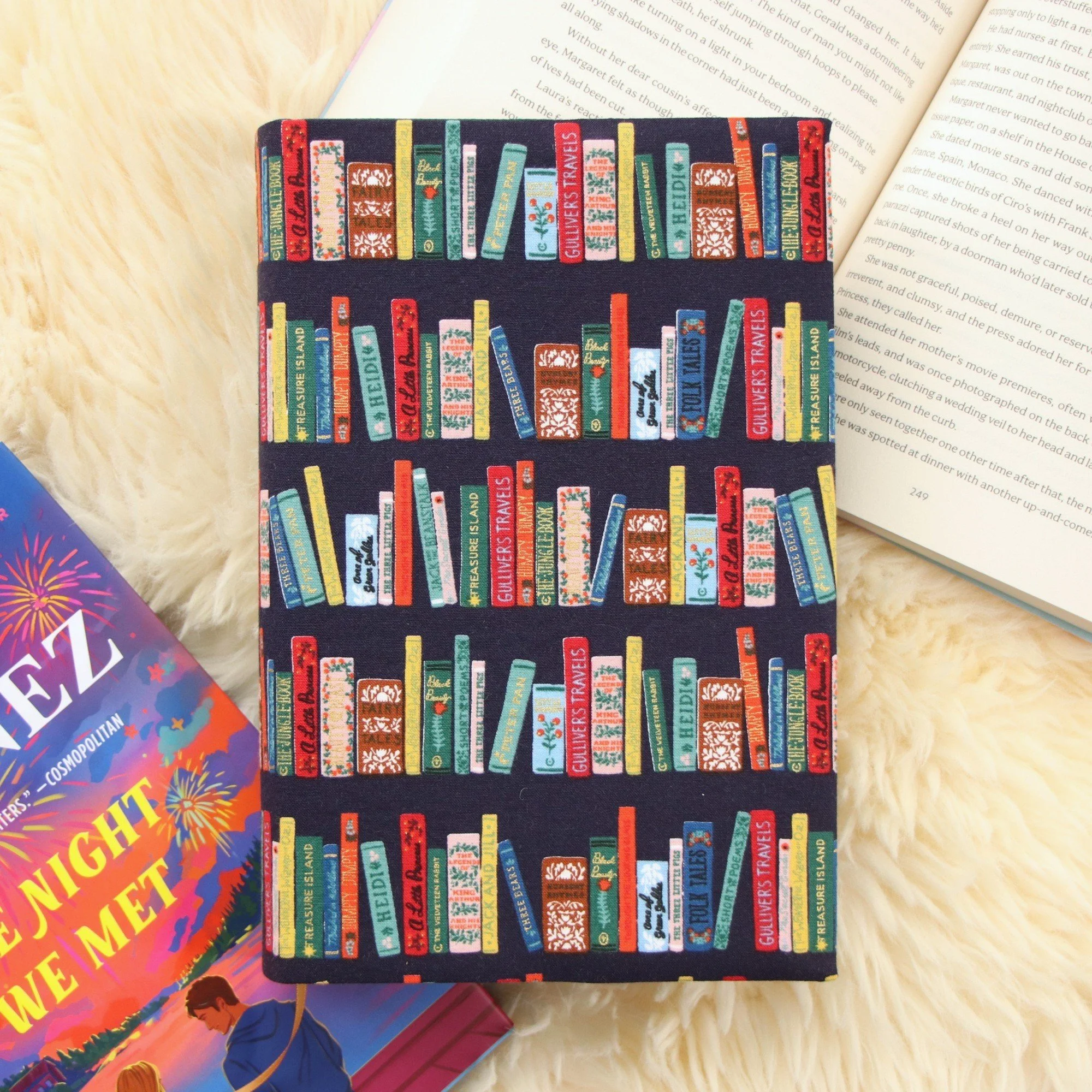 Handmade adjustable fabric First Edition book jacket protecting a hardcover book with Rifle Paper Co fabric.