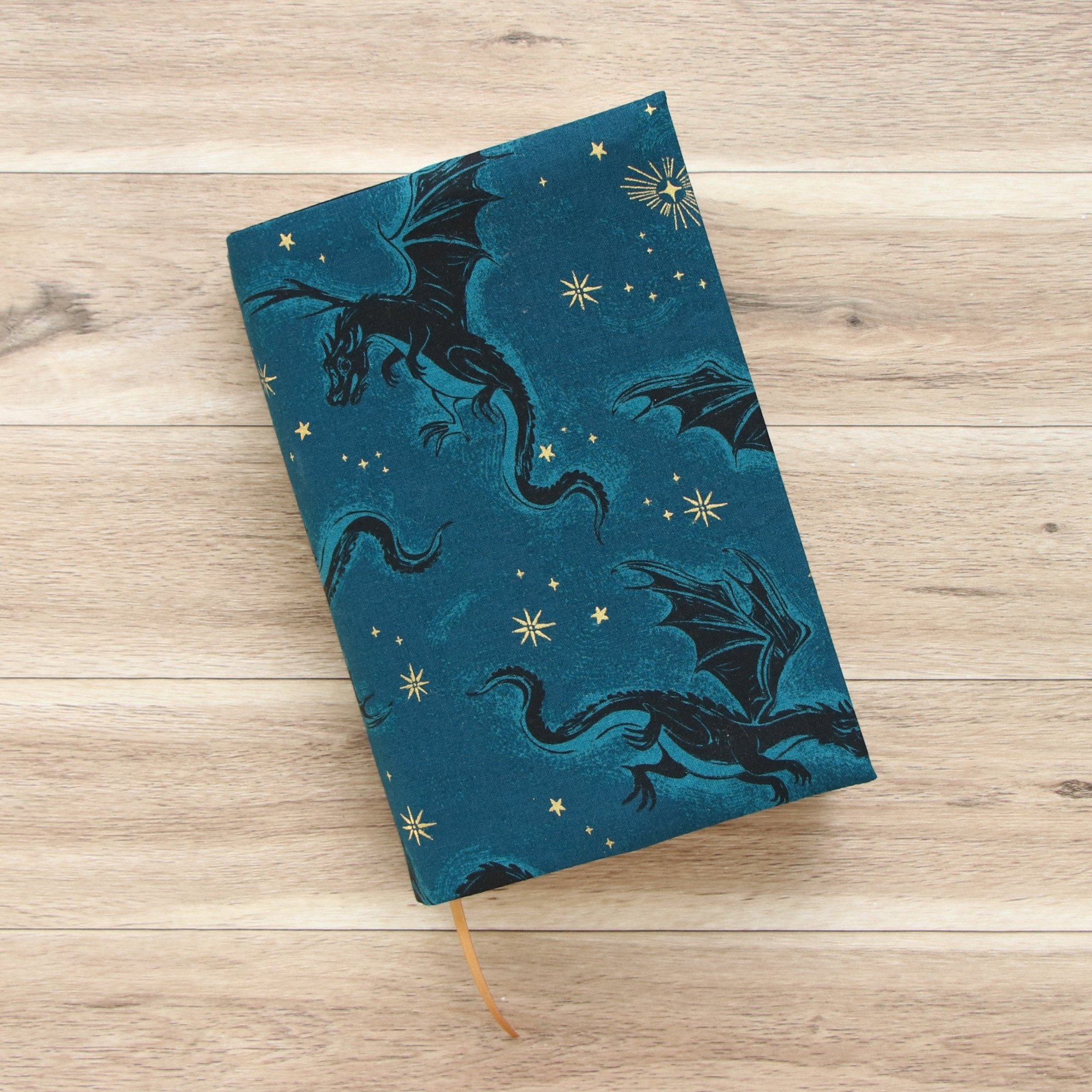 Adjustable First Edition Book Jacket showing built-in ribbon bookmark and protective fabric cover.