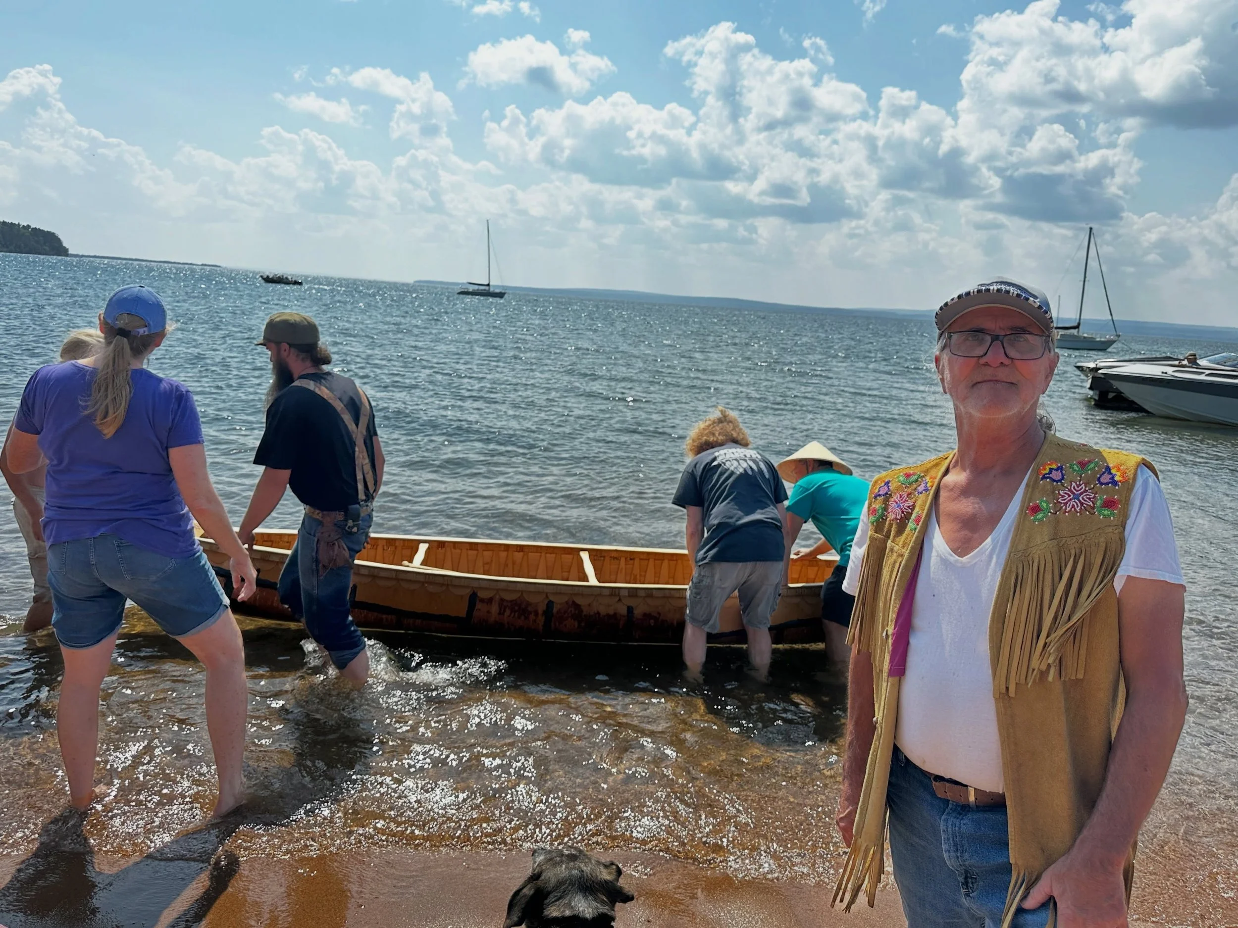 Marvin DeFoe with his newly built 1854 Treaty Wiigwas Jiman on Madeline Island.