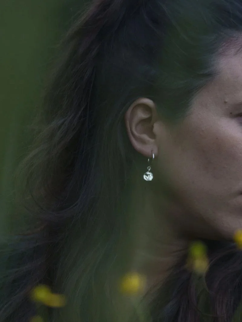 Wabi sabi inspired handmade silver earrings with small hoops and organic pendant for modern feminine jewellery lovers