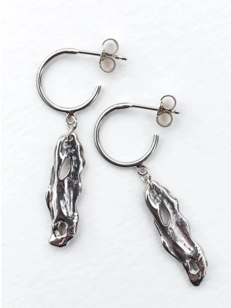 Ethical handmade silver earrings in recycled sterling silver, artisan jewellery with sculptural organic design.