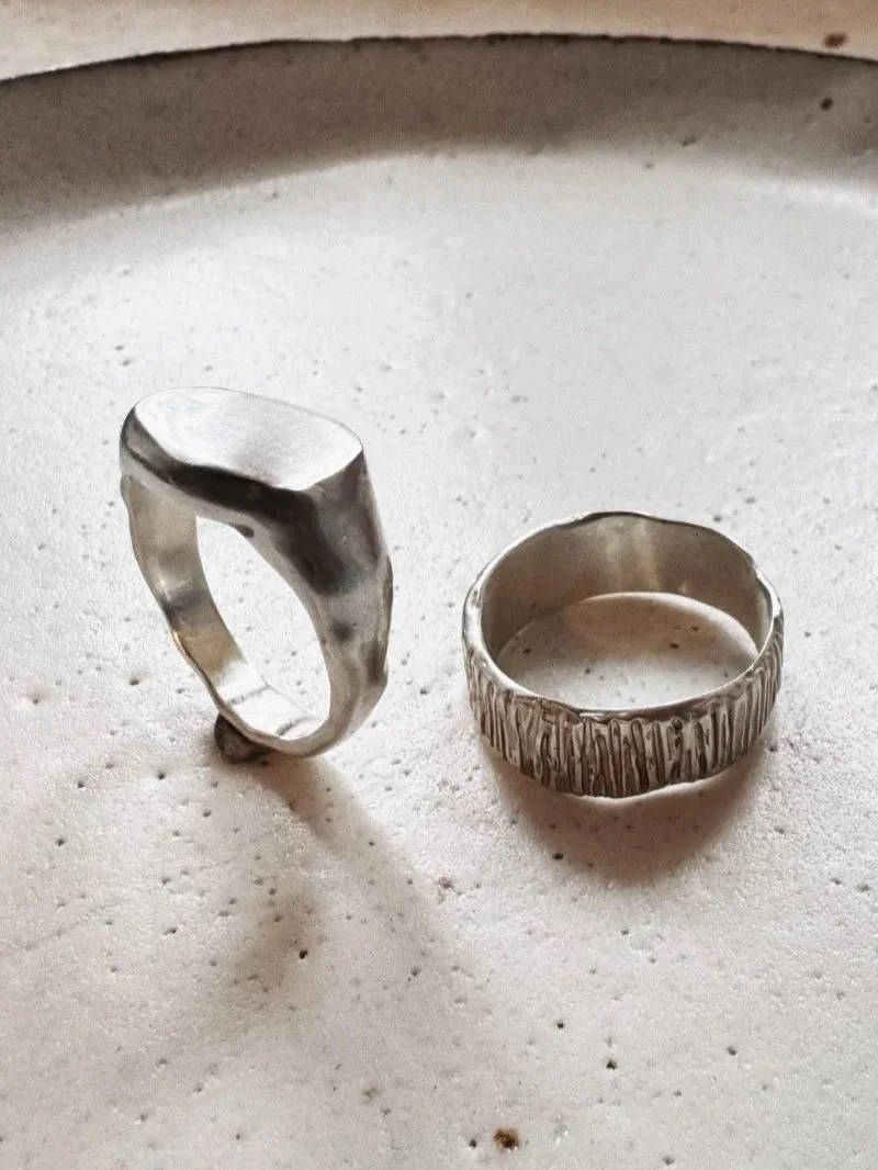Modern men’s silver signet ring with irregular flat top and organic wabi sabi details, handcrafted bold jewellery piece