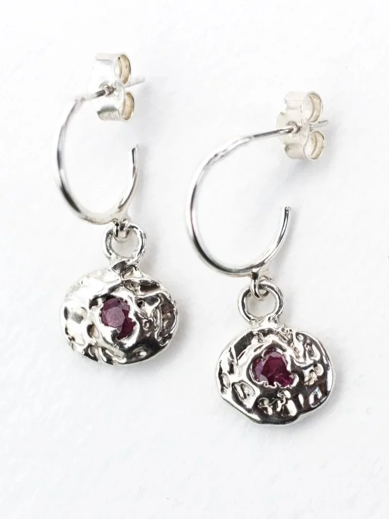 Contemporary handmade ruby earrings with raw texture and organic shape for modern wild women