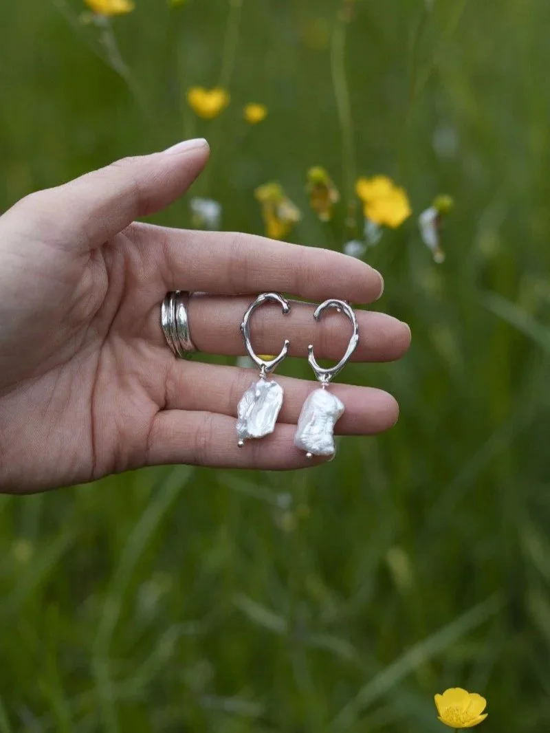 Organic silver pearl earrings handcrafted from recycled sterling silver and real freshwater cultured keshi pearls.