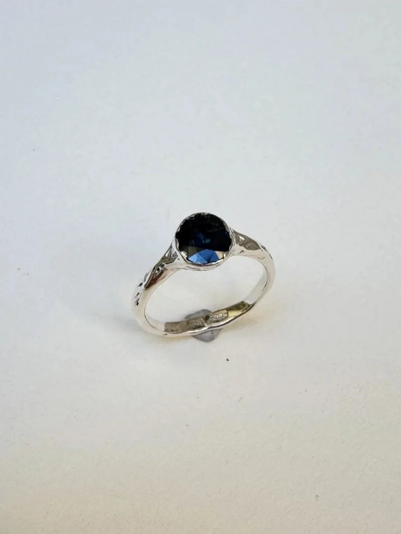 Handmade gold Wabi Sabi ring with deep blue sapphire