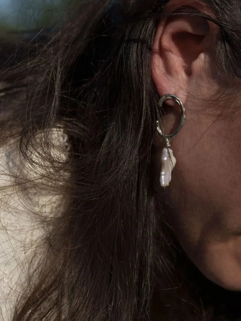 Sustainable handmade silver earrings with keshi pearls, sculptural statement jewellery with organic texture.