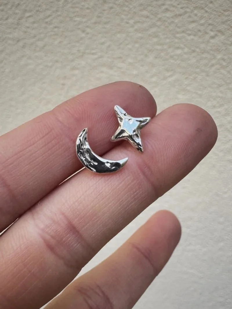 Handcrafted moon and star earrings with a dainty, dreamy look, made from recycled silver or gold for everyday wear.