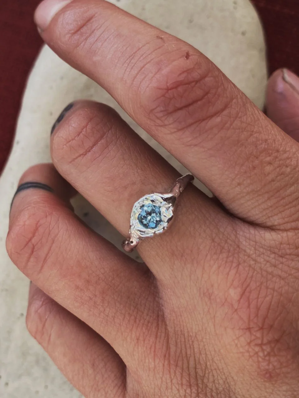 Light blue topaz ring handcrafted in recycled sterling silver or 14ct and 18ct gold with an earthy, sculptural organic design.