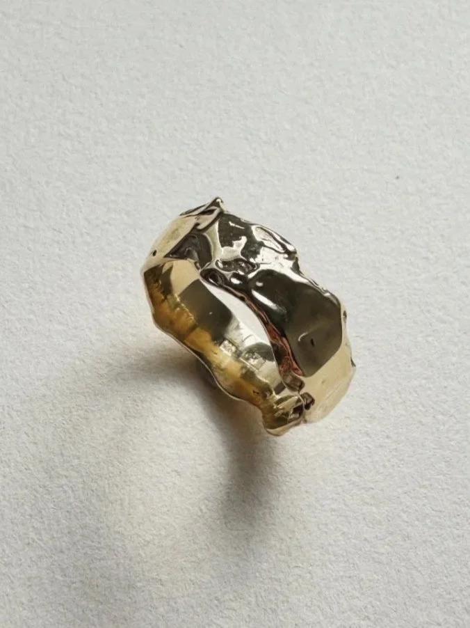 Handmade gold alternative wedding band by Nika Klinec