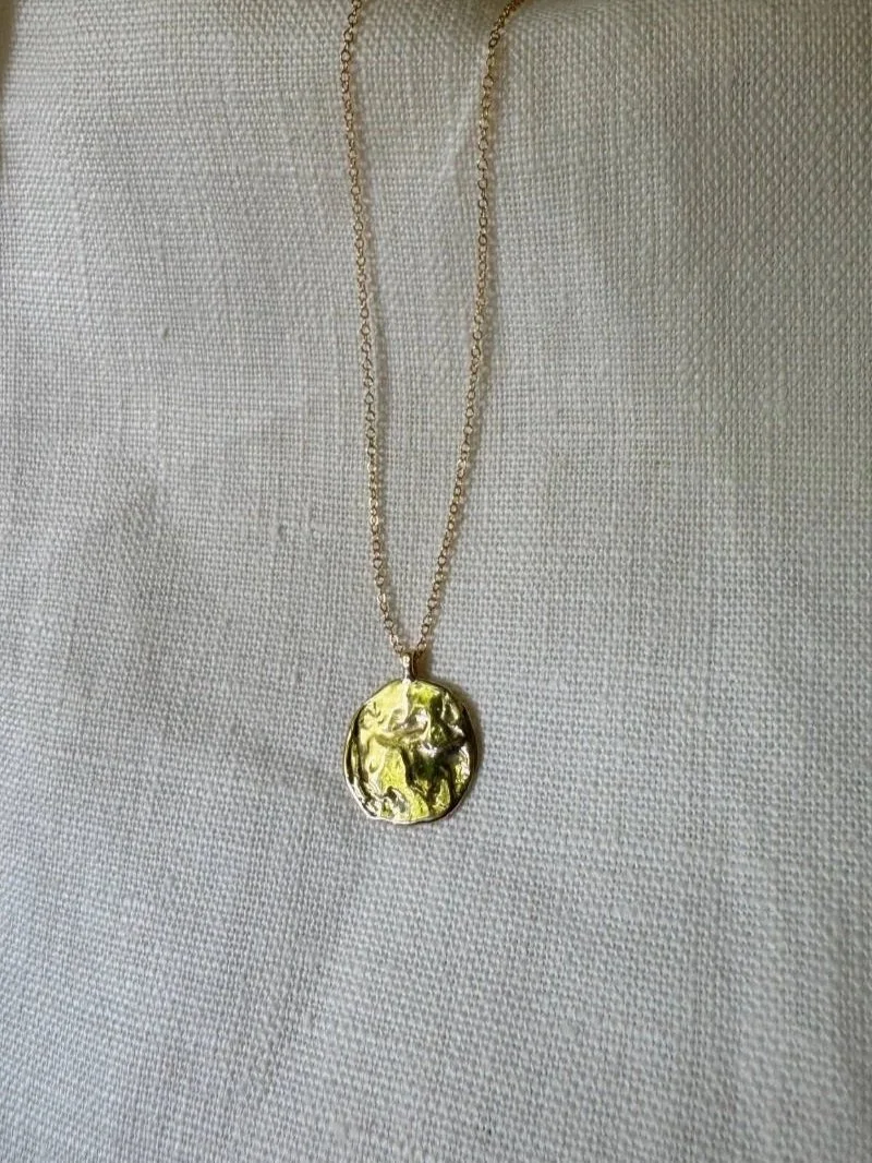 Handmade moon pendant necklace in recycled 14ct or 18ct gold with a sculptural celestial charm and timeless artisan elegance.