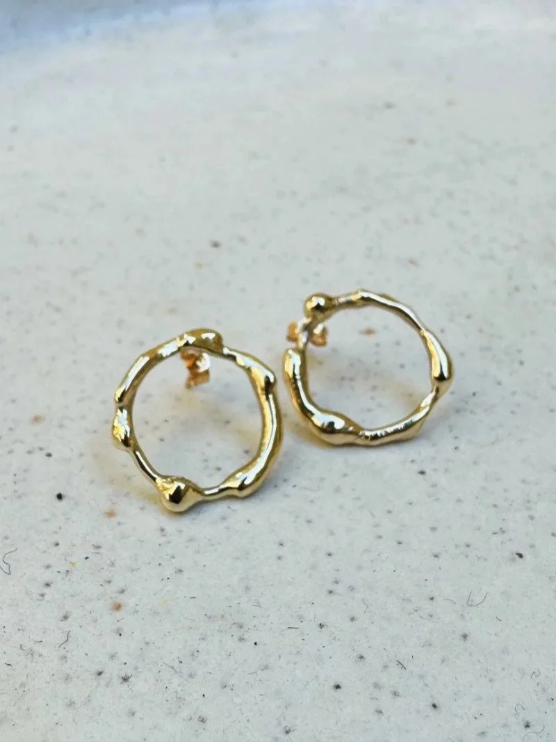 Handmade gold Agni earrings with organic fire-shaped forms