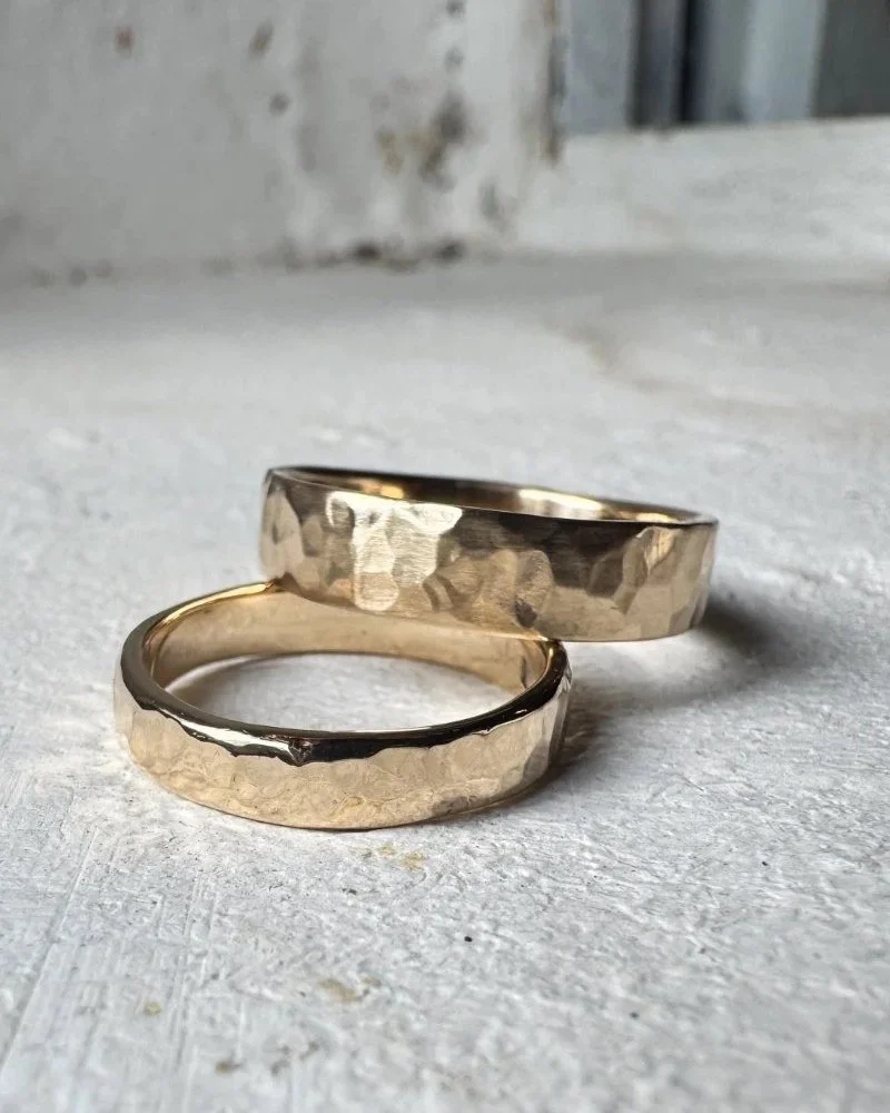 Hand hammered wedding rings in 14 carat recycled ethical gold.