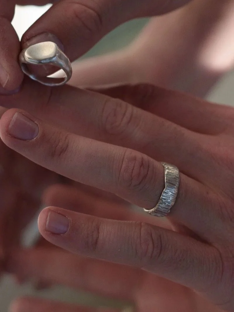 Organic men’s wedding band in solid 925 sterling silver, handcrafted with a wide twisted band, edgy texture and minimalist masculine style.